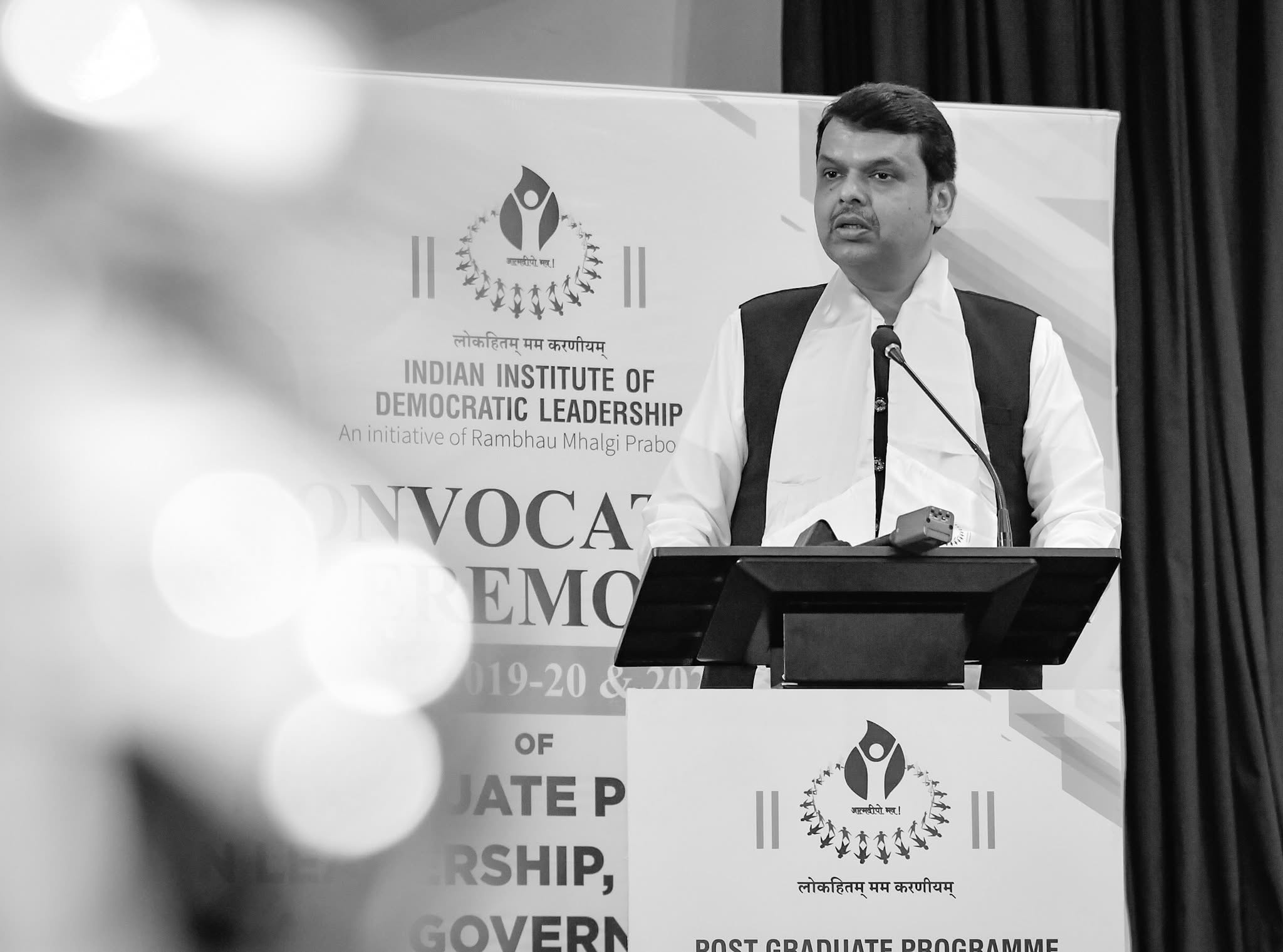Black and white portrait of a speaker at an IIDL convocation